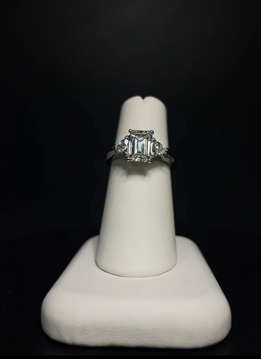 The Emerald Cut Three Stone Ring